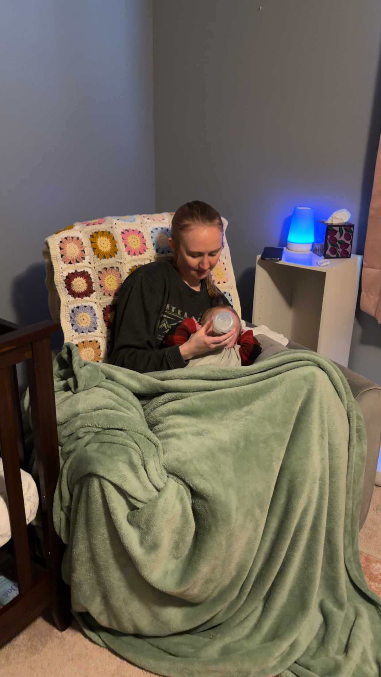 The author feeds her daughter a bottle.